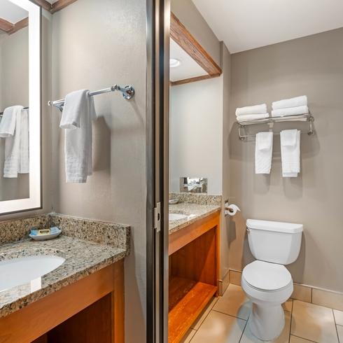 Modern Bathroom with Granite Countertops and Bathtub
