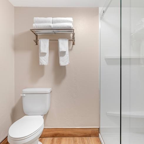 Modern bathroom with granite vanity and premium amenities in the King Suite at Best Western Grantree Inn.