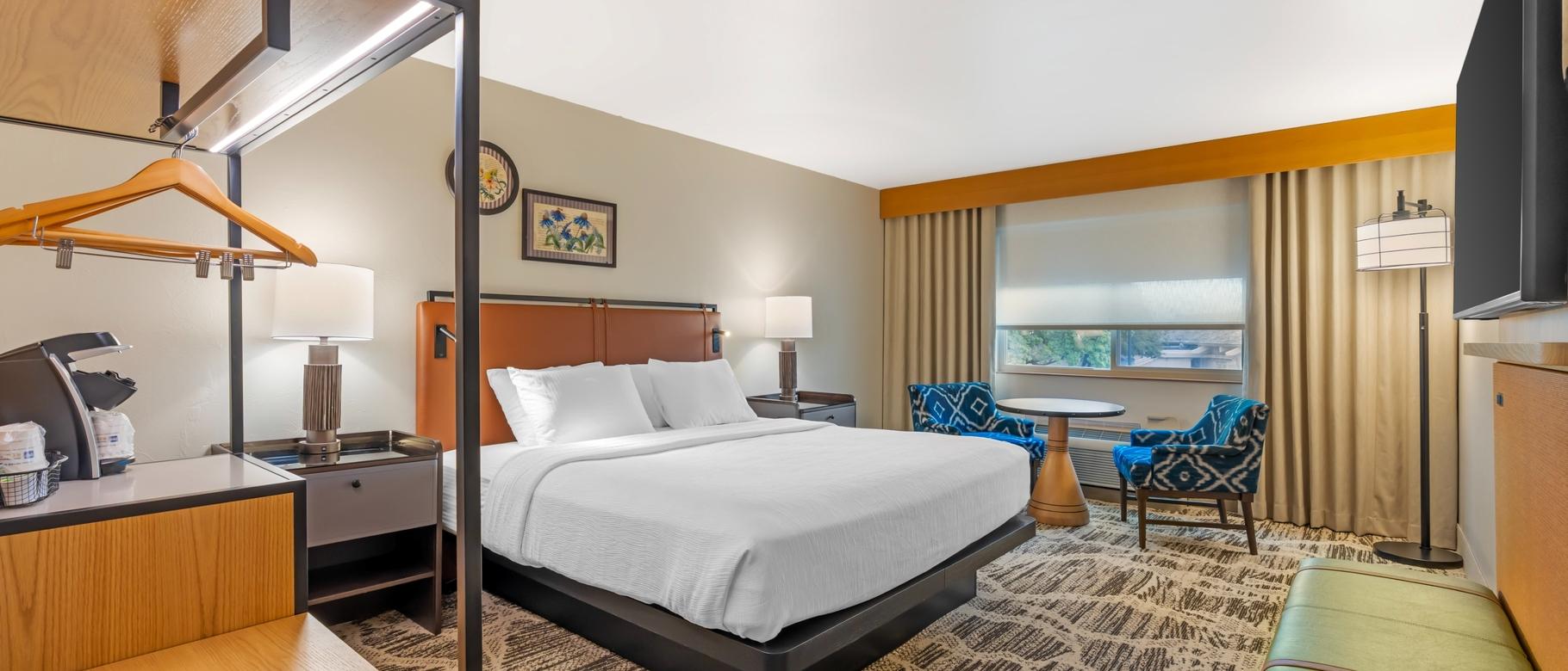 King Guest Room with Table & Chairs at Best Western GranTree Inn.